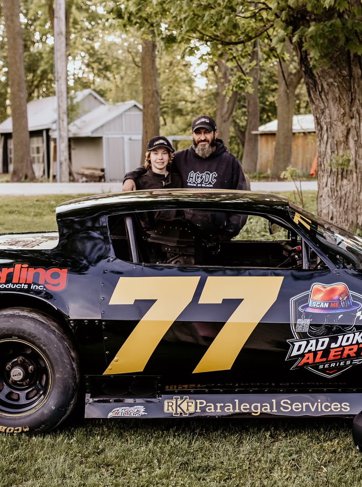 Ayden McNicol with his dad behind the #77 Hot Rod