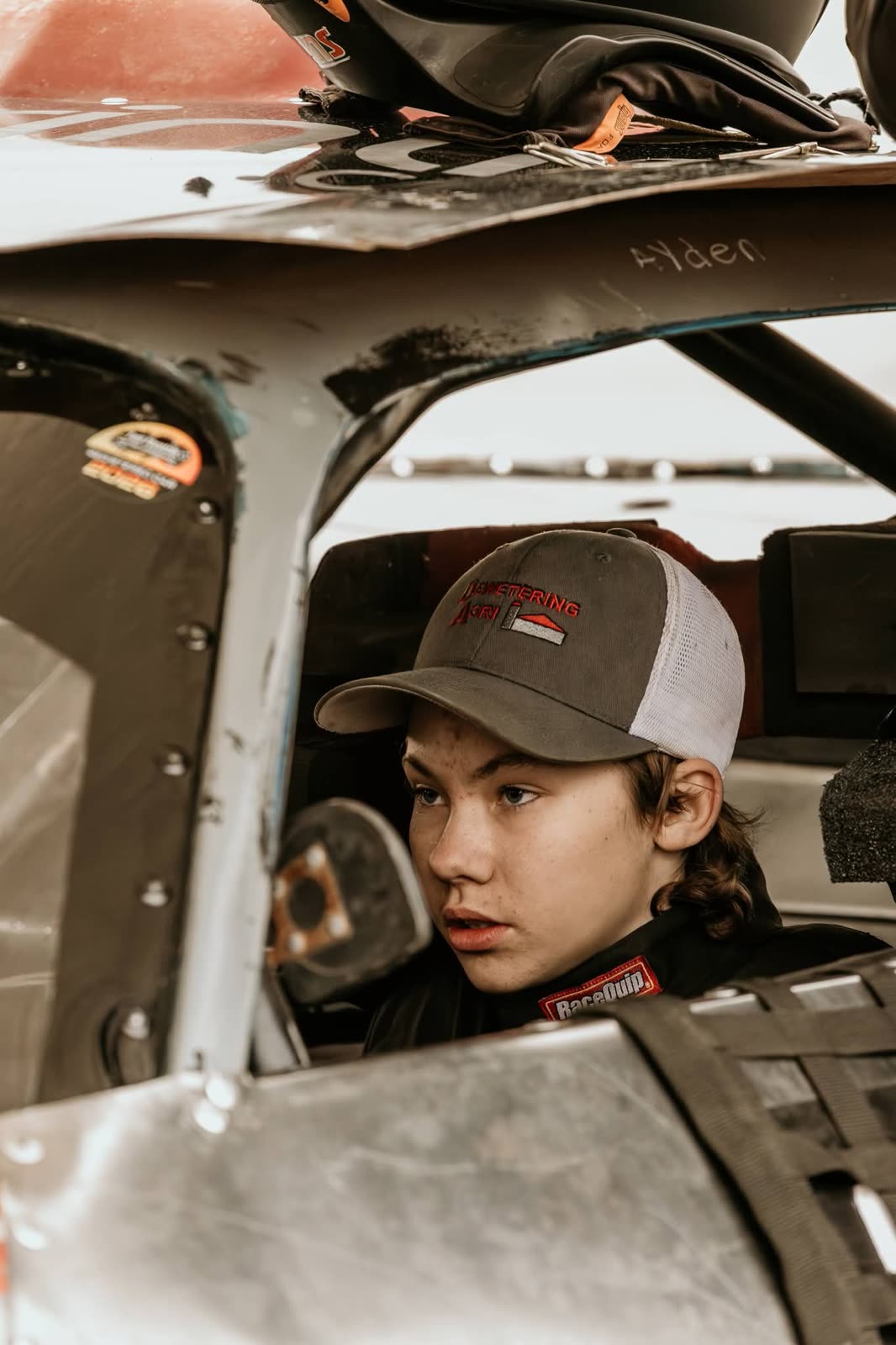 Ayden McNicol focused in the cockpit of his race car